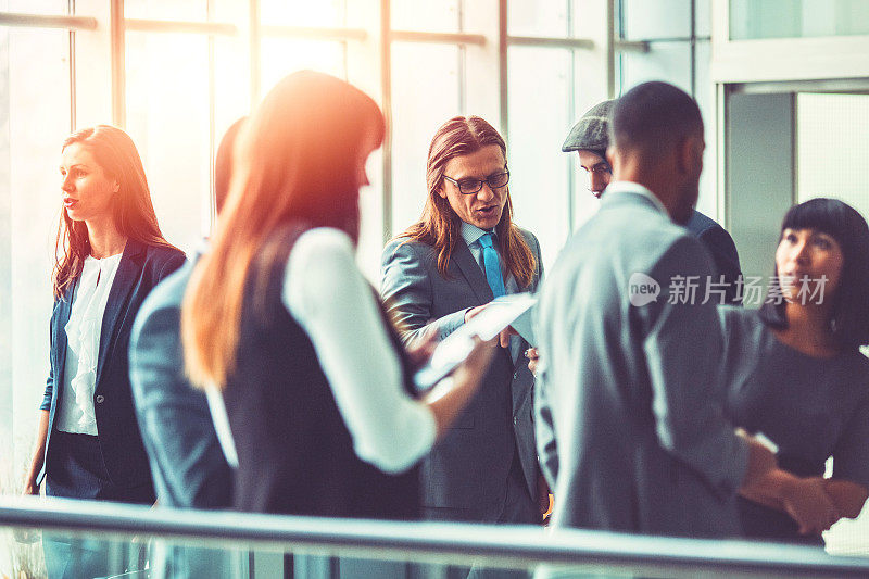 Group of business people in the office building lobby